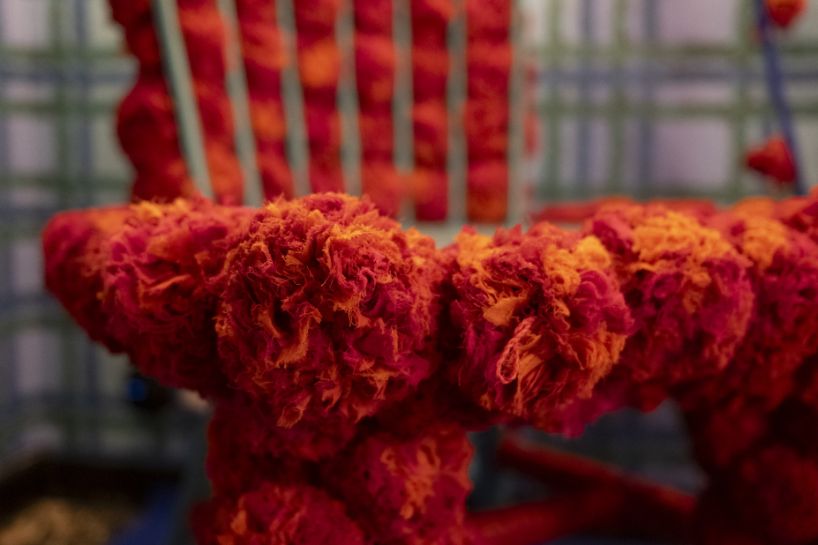 women refugee artisans weave otto studio's 'making knots' installation at milan design week
