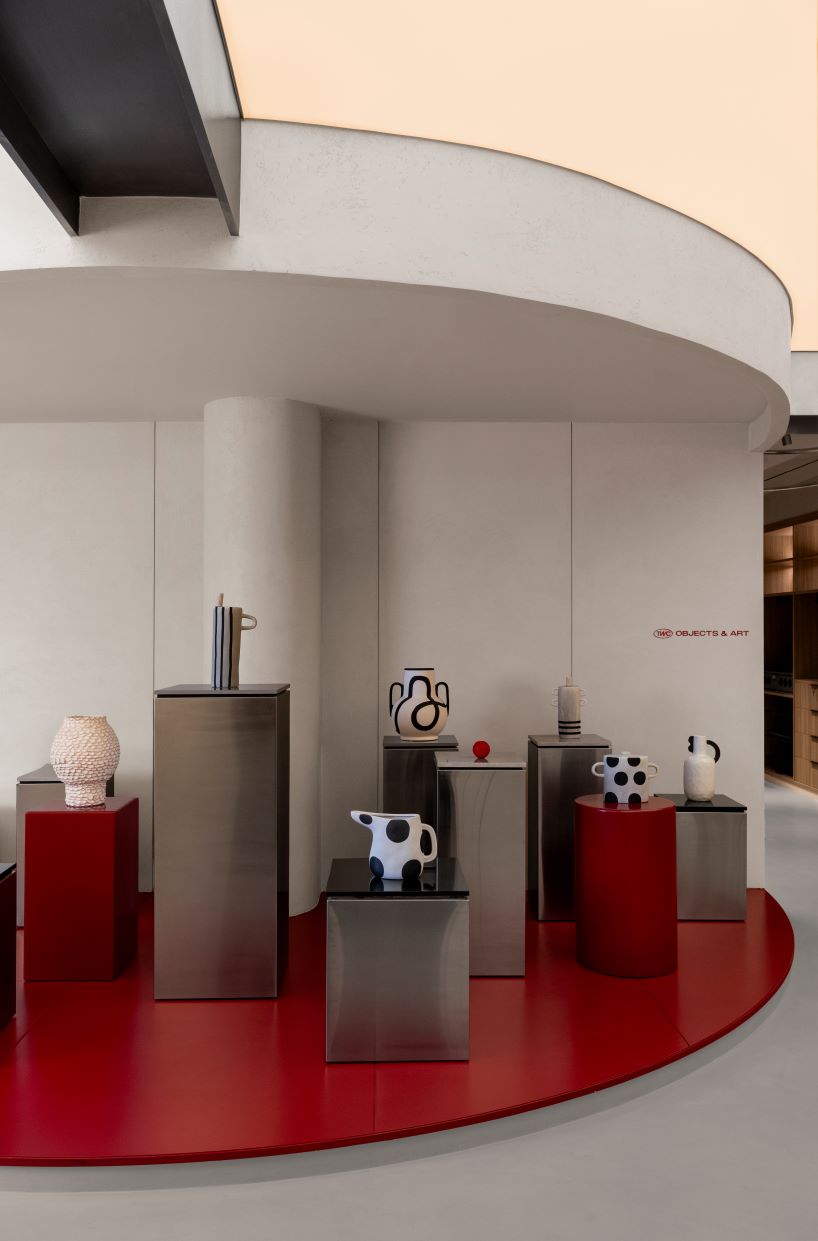 concrete and steel textures shape showroom in india organized as a continuous loop