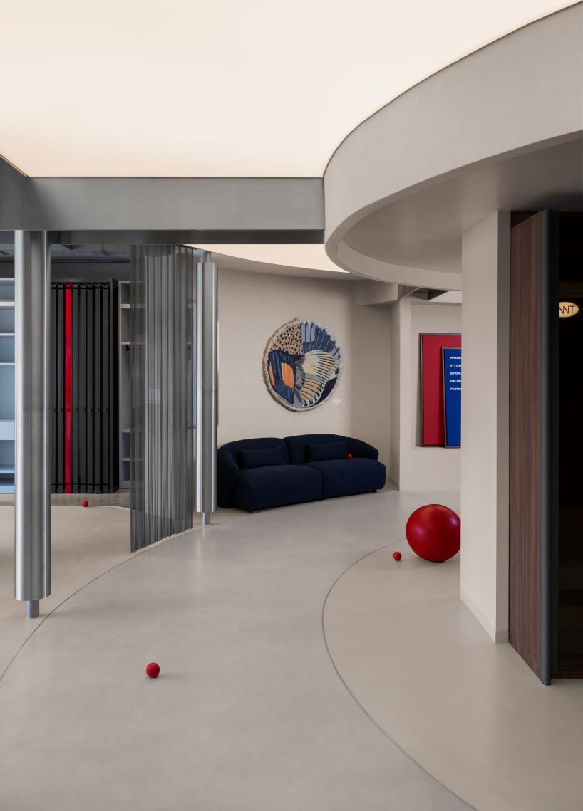 concrete and steel textures shape showroom in india organized as a continuous loop