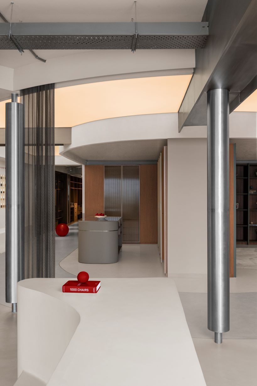 concrete and steel textures shape showroom in india organized as a continuous loop