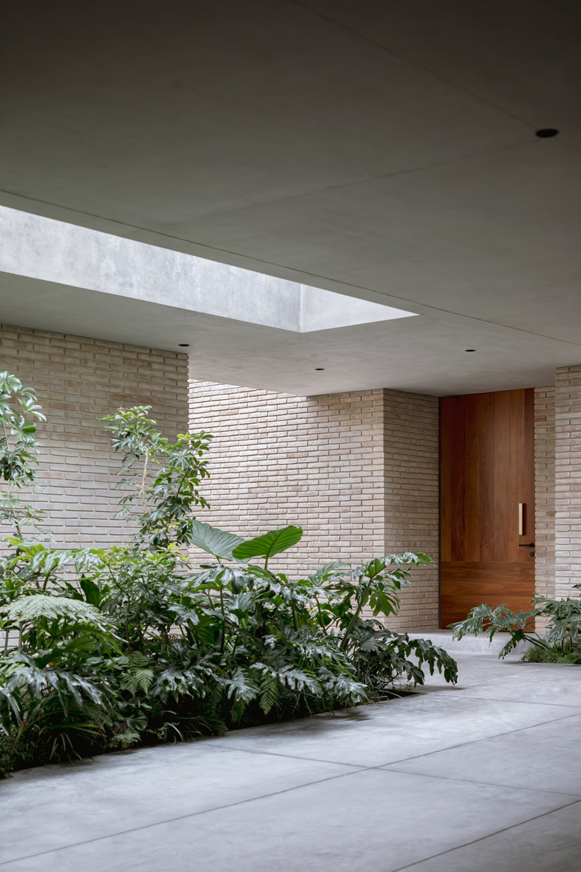 asps white clay brick residence revolves around interior courtyards in mexico city 11