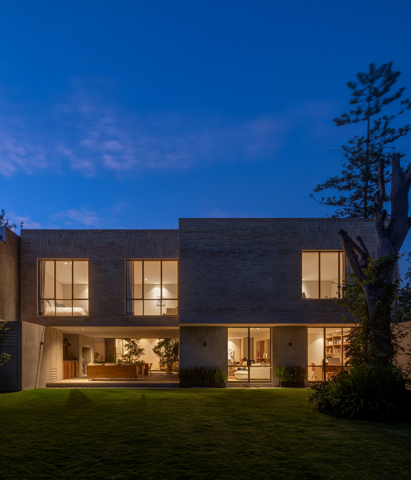 white clay brick residence revolves around interior courtyards in ...