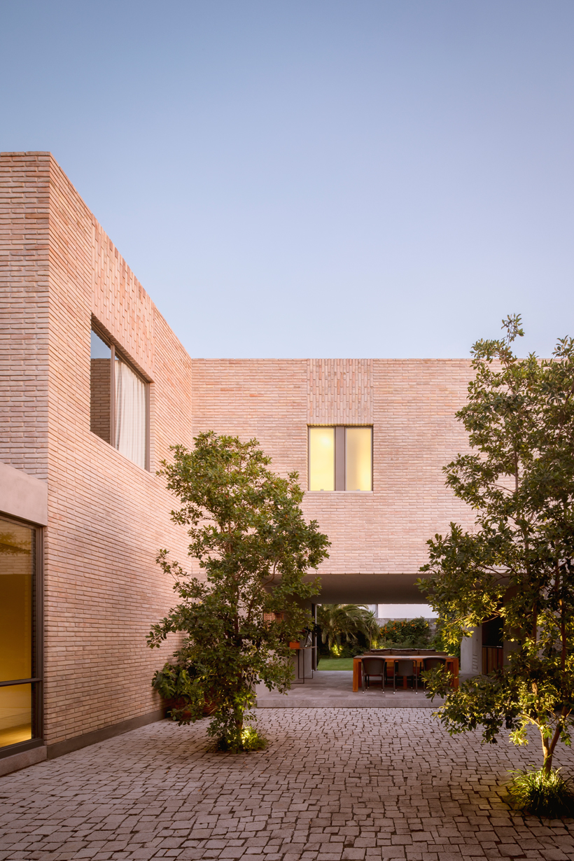 asps white clay brick residence revolves around interior courtyards in mexico city 4
