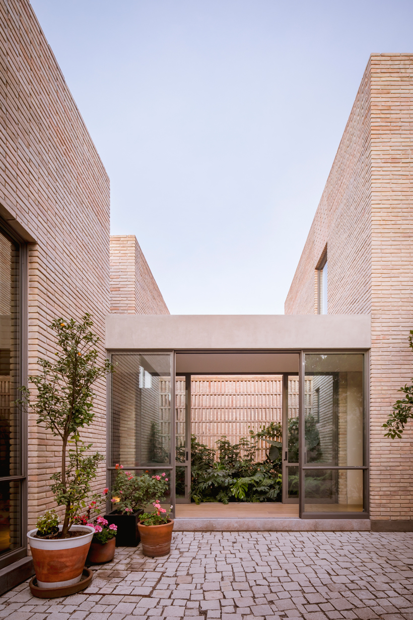 asps white clay brick residence revolves around interior courtyards in mexico city 5