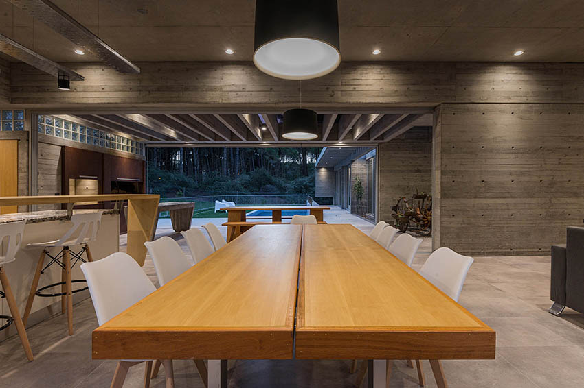 scale-like concrete façade interrupts dwelling's horizontality in argentina by estudio galera