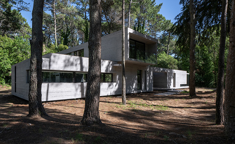 overlapping volumes of concrete and glass compose tucán house in ...