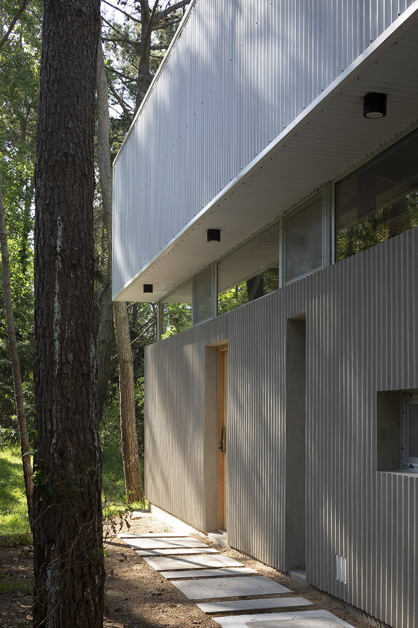 mobile wood and metal structures enable flexibility at estudio galera's buenos aires home
