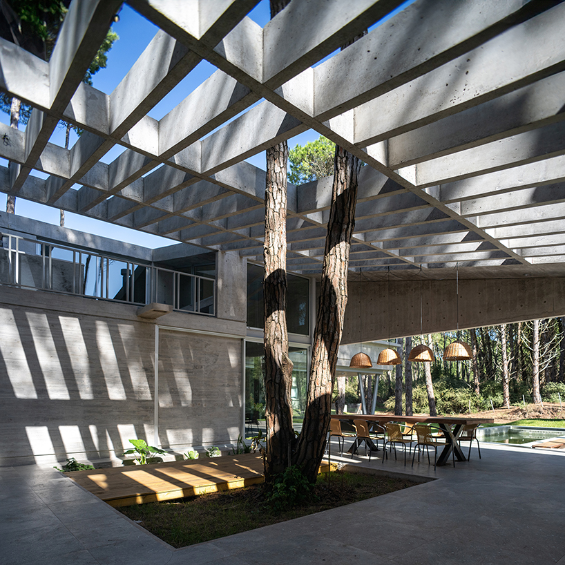 triangular concrete wedge shelters estudio galera's kairos house in argentina