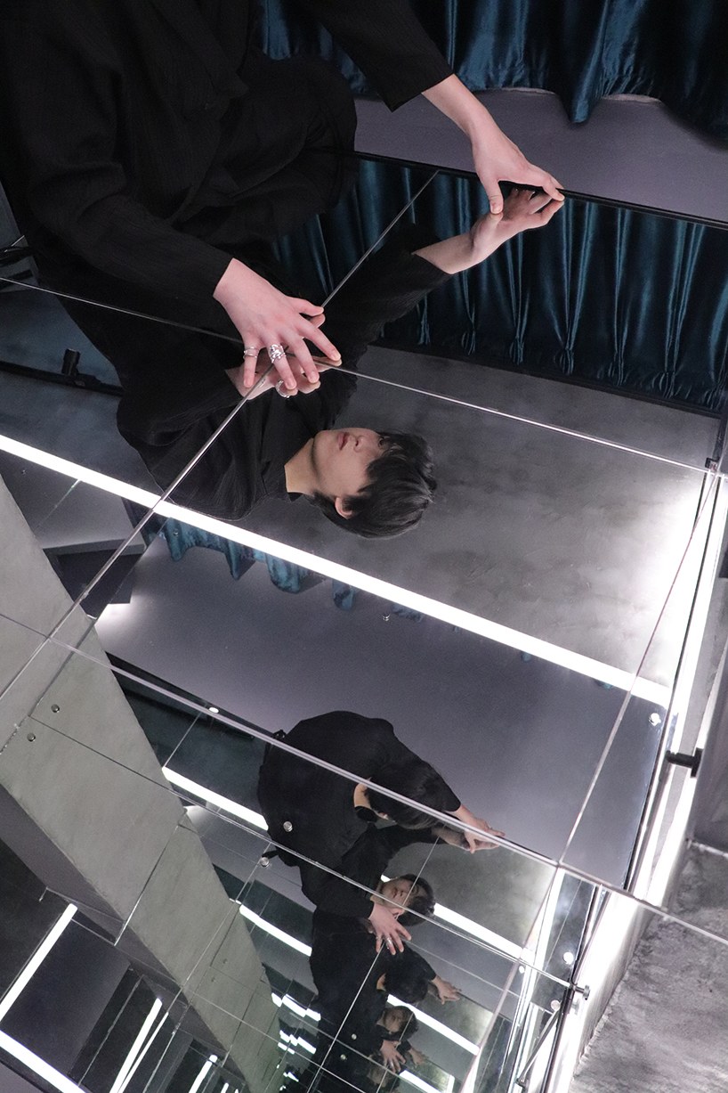 deserted 45-year-old basement is transformed into mirror-clad art space in guangzhou, china