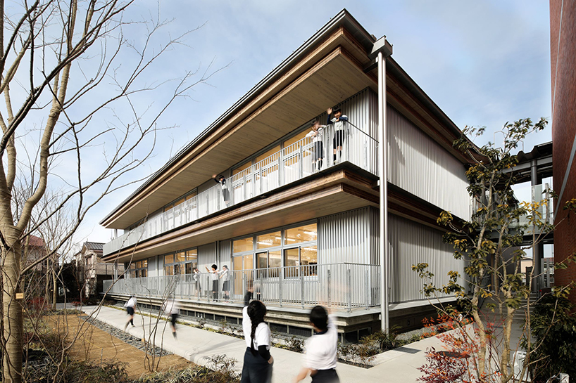 exposed flat timber slabs extend contemporary educational facility by NIKKEN SEKKEI