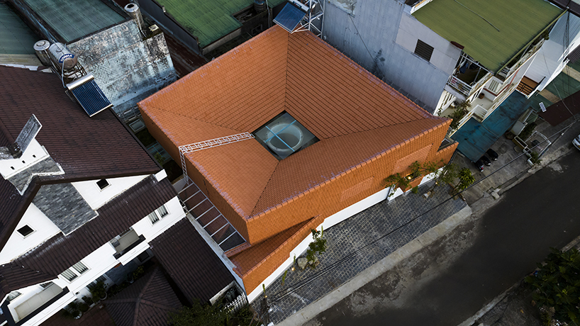 the bloom architects' tile-wrapped house regulates vietnam's tropical and temperate climate