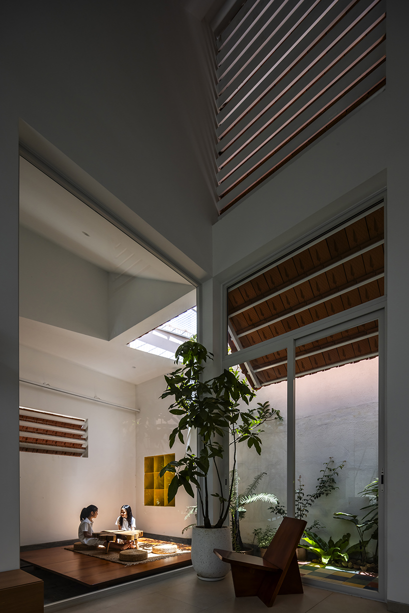 the bloom architects' tile-wrapped house regulates vietnam's tropical and temperate climate