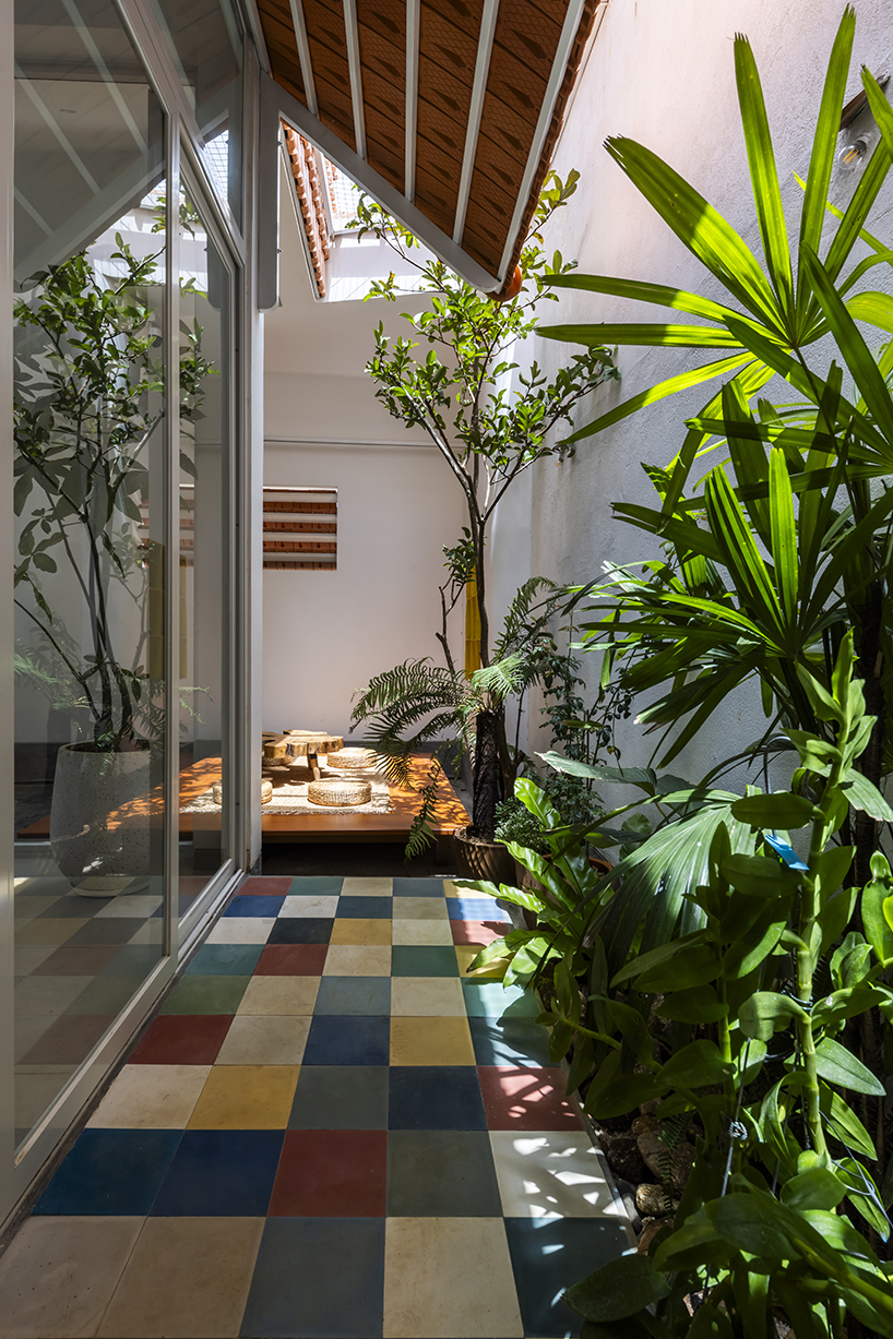 the bloom architects' tile-wrapped house regulates vietnam's tropical and temperate climate