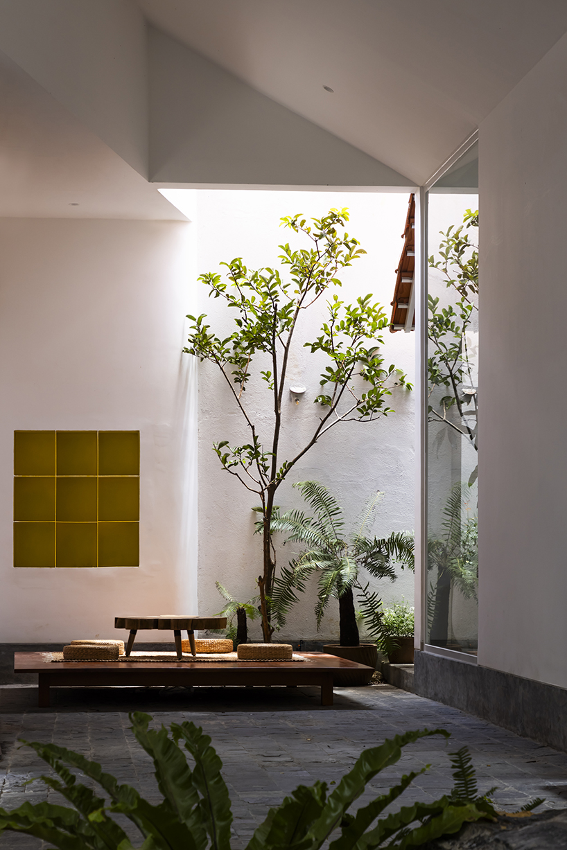 the bloom architects' tile-wrapped house regulates vietnam's tropical and temperate climate