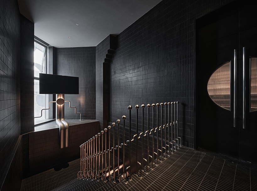 organic lights, mirrors & dark hues complete restaurant renovation by PIG design in hangzhou
