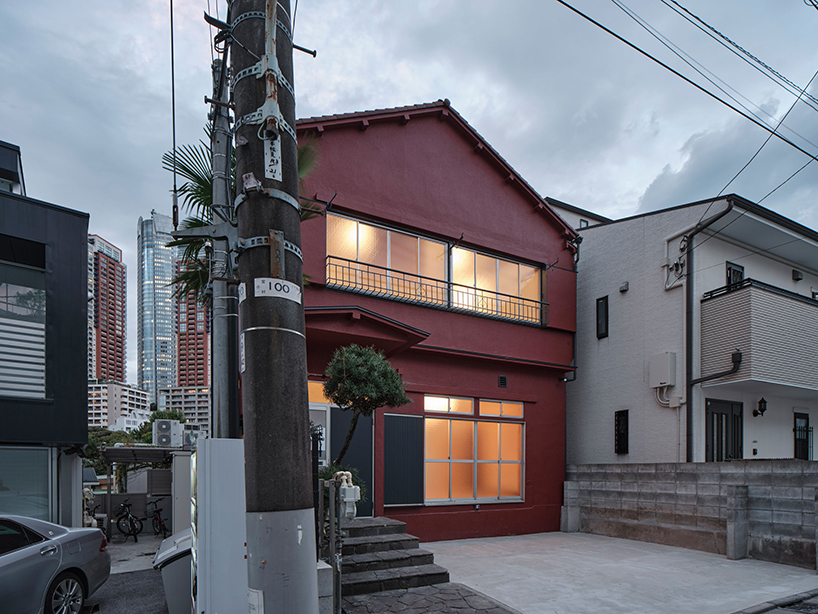 renovated wooden house boasts bright red facade in central tokyo
