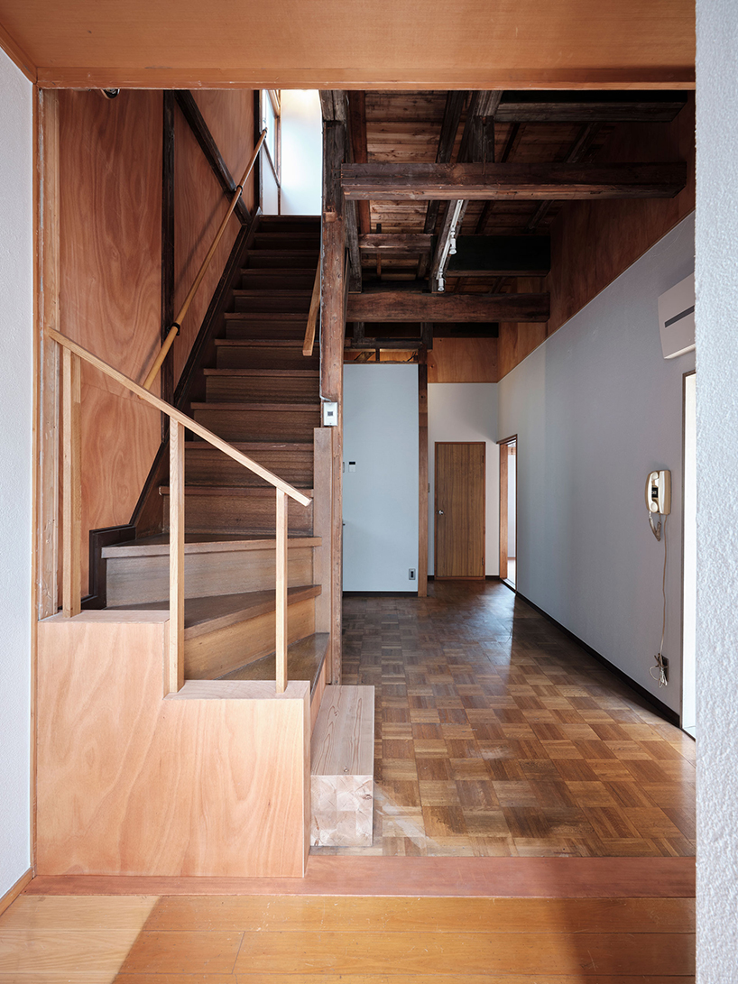 renovated wooden house boasts bright red facade in central tokyo