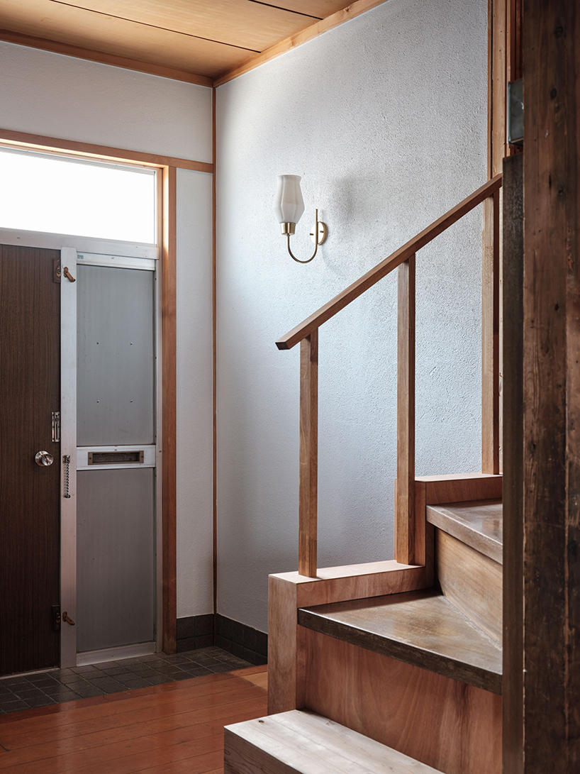 renovated wooden house boasts bright red facade in central tokyo