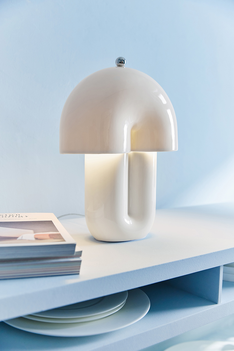 split ceramic curves cast soft reflected light in dimmable table lamp - 2