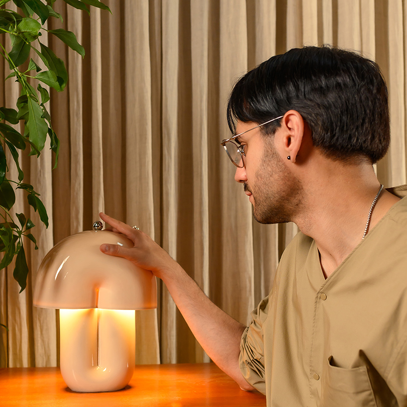 split ceramic curves cast soft reflected light in dimmable table lamp - 6