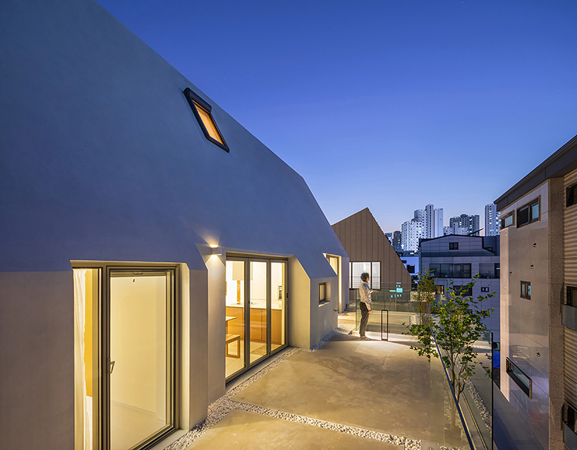 house-shaped volume in korea by rieuldorang atelier marks 'with home' corporate identity