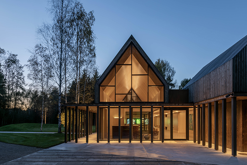 gabled timber volumes weave sanctum cabin retreat into the lithuanian forest - 9