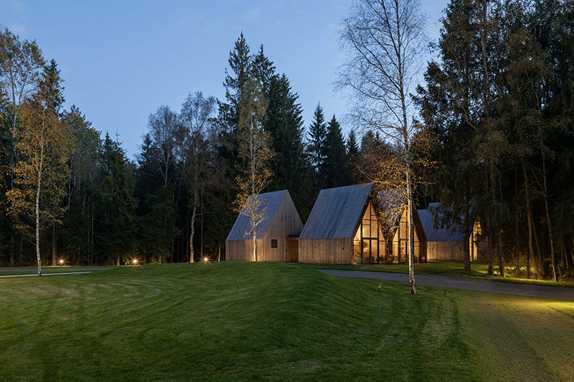 gabled timber volumes weave sanctum cabin retreat into the lithuanian forest - 11