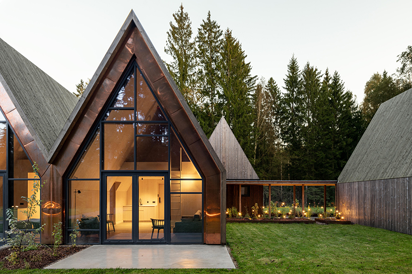 gabled timber volumes weave sanctum cabin retreat into the lithuanian forest - 4