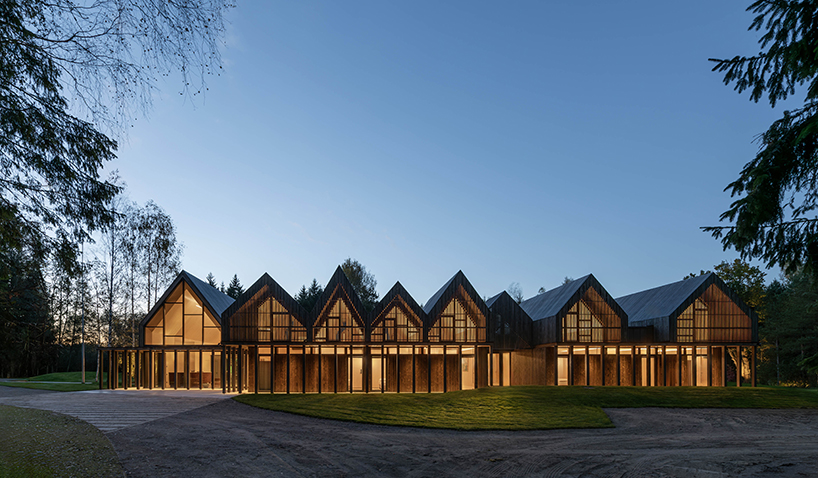 gabled timber volumes weave sanctum cabin retreat into the lithuanian forest - 10