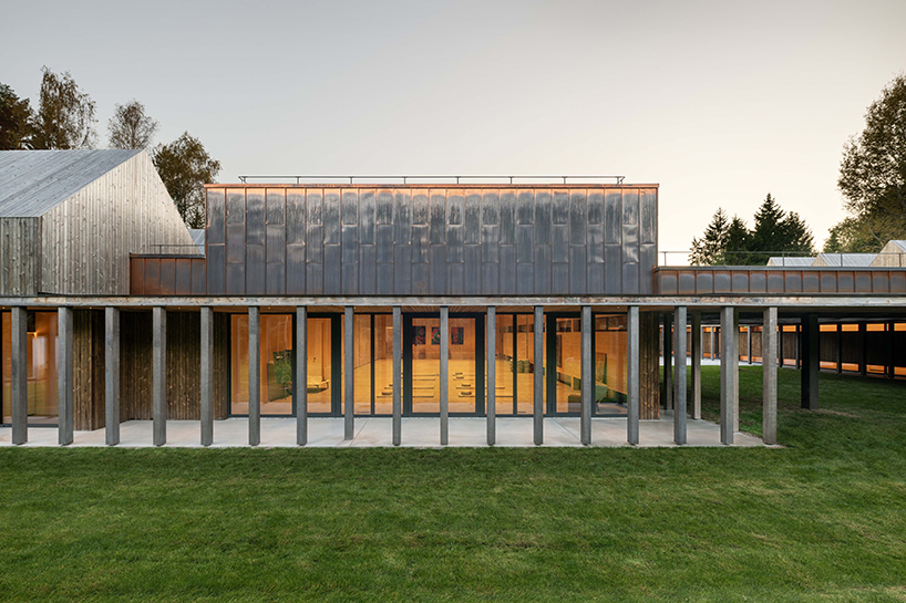 gabled timber volumes weave sanctum cabin retreat into the lithuanian forest - 5