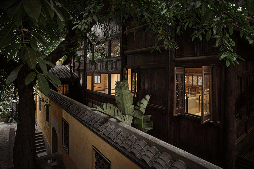 traditional tiled roofs crown the stepped modules of office and cafe space in china