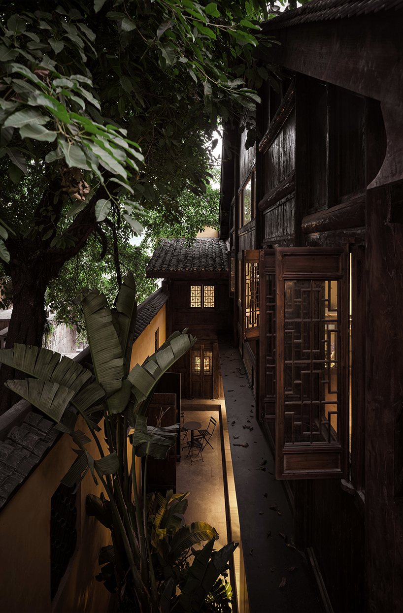 traditional tiled roofs crown the stepped modules of office and cafe space in china