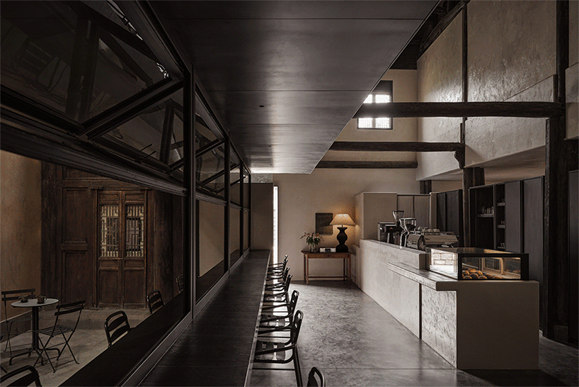traditional tiled roofs crown the stepped modules of office and cafe space in china
