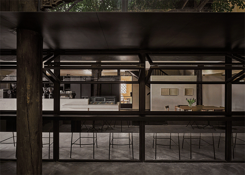 traditional tiled roofs crown the stepped modules of office and cafe space in china
