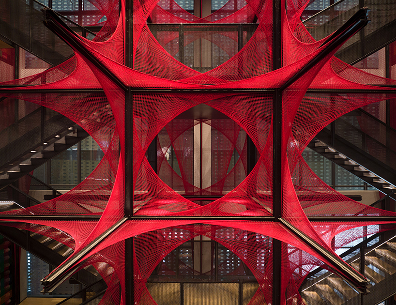 150.000 meters of vibrant red brocade threads compose installation in china