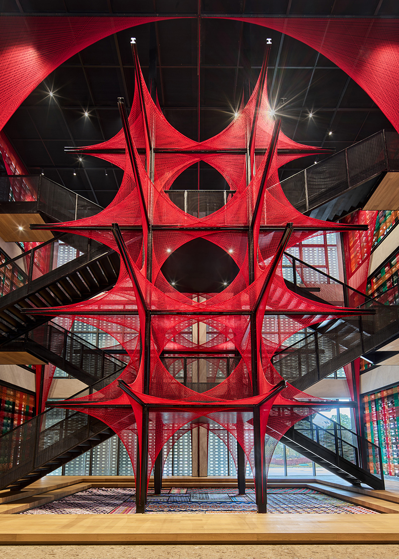 150.000 meters of vibrant red brocade threads compose installation in china