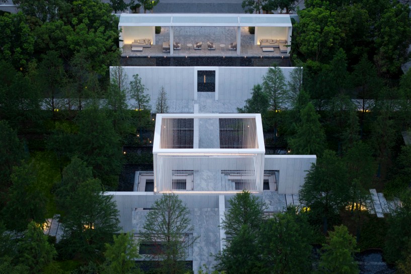 a garden-within-a-garden unfolds through water, translucent pavilions, and green courtyards - 13