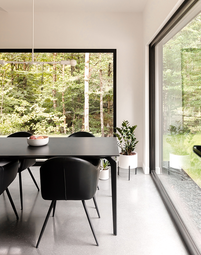 monochromatic house's geometric forms frame natural plateau in canada