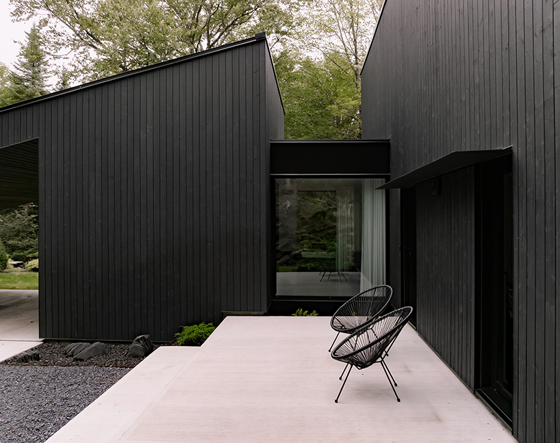 monochromatic house's geometric forms frame natural plateau in canada