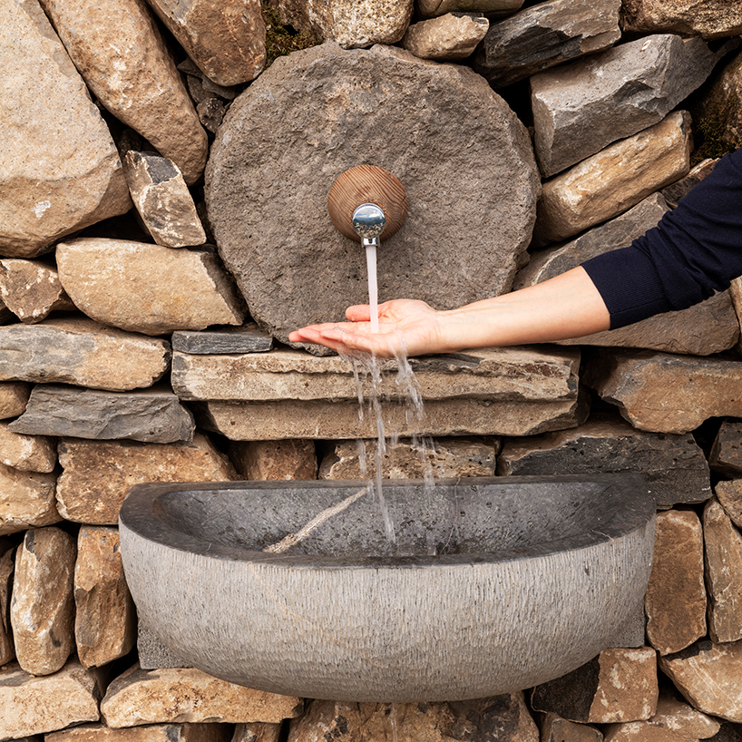 suchaillou stone shelter embeds within rocky outcrop along santiago de compostela route