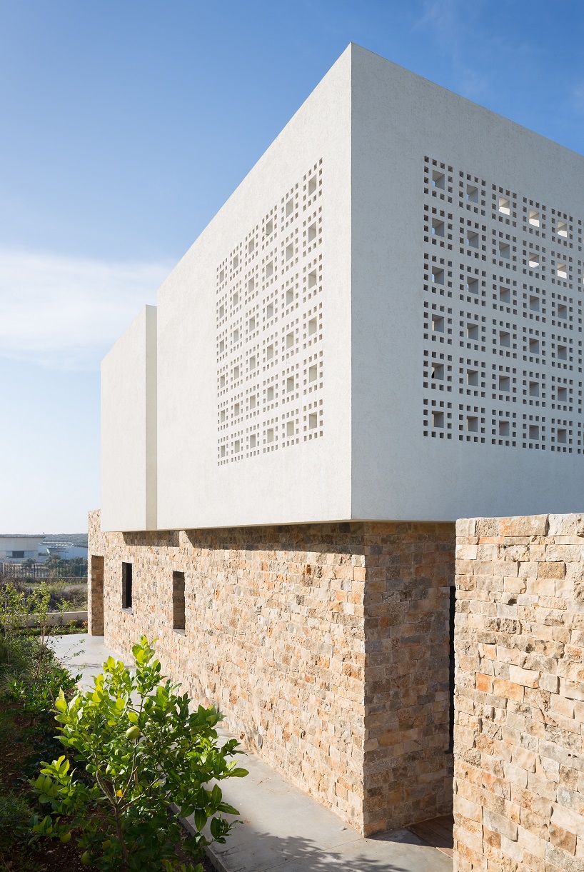 checkered perforations decorate minimalist house by shira ben ezra in israel