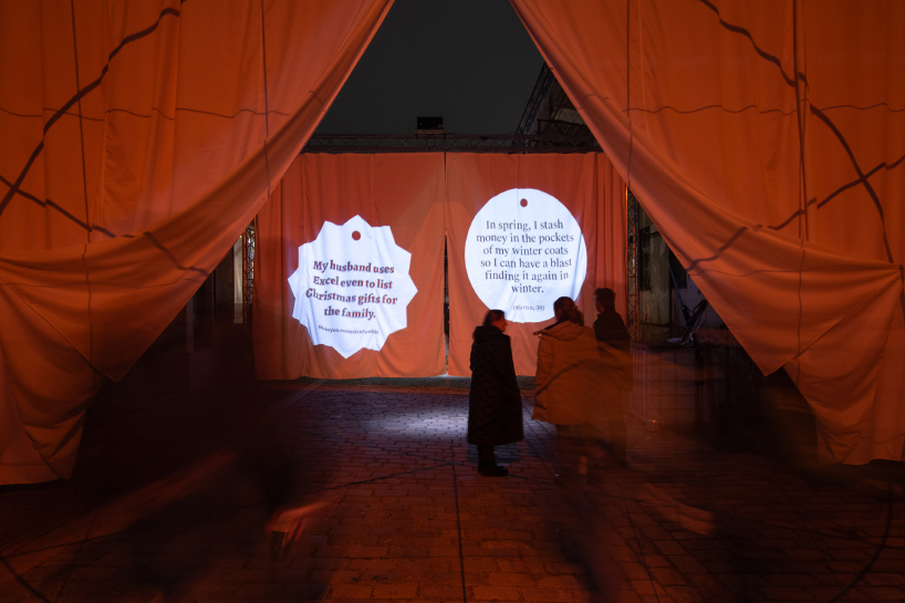 red and white curtains transform czech historic center’s pathways into christmas installation