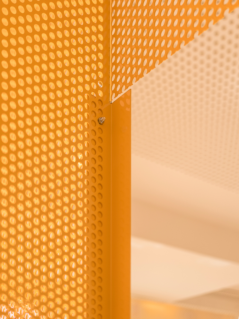 bright orange perforated metal sheets shape a modular fitness center in madrid - 9