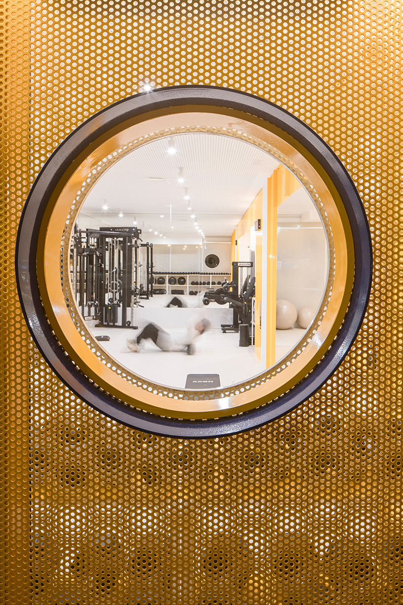 bright orange perforated metal sheets shape a modular fitness center in madrid - 12