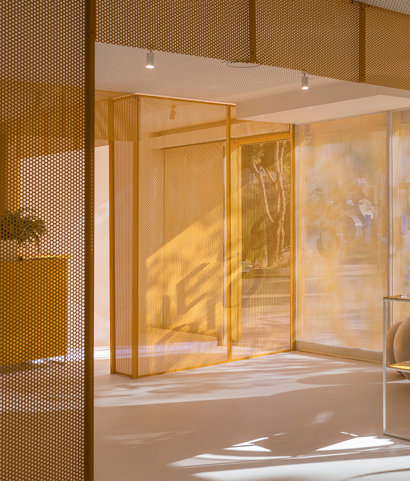 bright orange perforated metal sheets shape a modular fitness center in madrid - 8