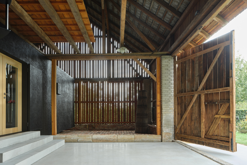 black asphalt and birch plywood shape compact retreat within czech barn - 6