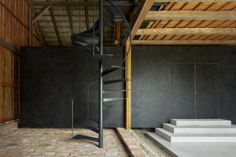 black asphalt and birch plywood shape compact retreat within czech barn - 7