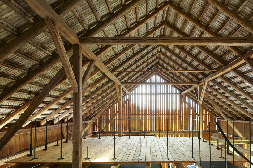 black asphalt and birch plywood shape compact retreat within czech barn - 8