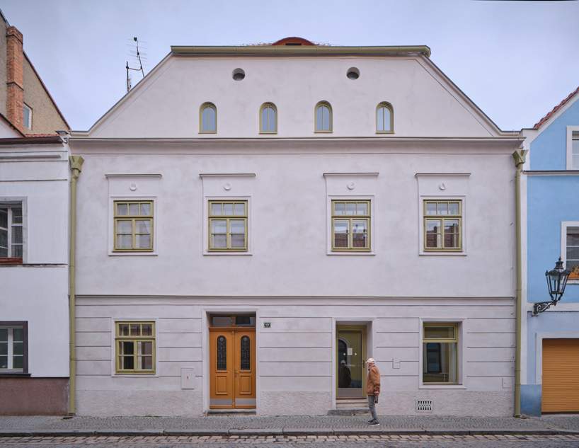 reclaimed materials and handcrafted finishes reshape historic townhouse in czech republic - 1