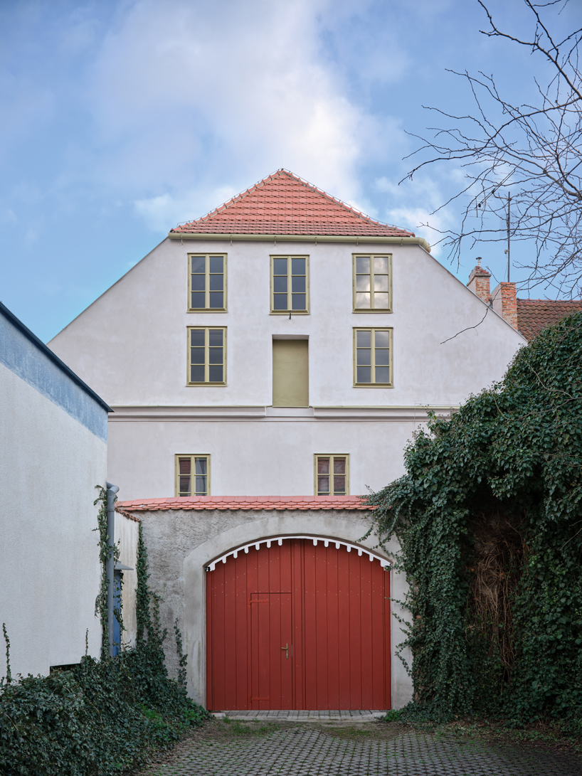 reclaimed materials and handcrafted finishes reshape historic townhouse in czech republic - 2